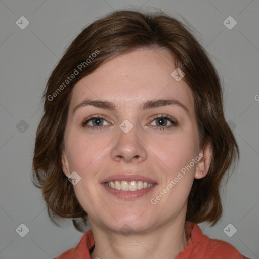 Joyful white young-adult female with medium  brown hair and blue eyes