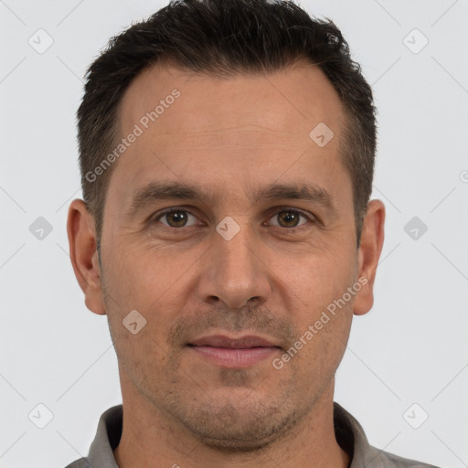 Joyful white adult male with short  brown hair and brown eyes