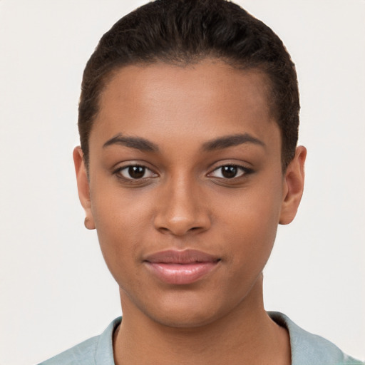 Joyful black young-adult female with short  brown hair and brown eyes