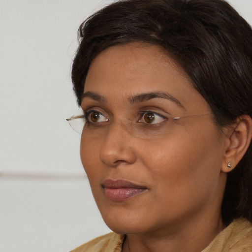 Neutral black young-adult female with long  brown hair and brown eyes