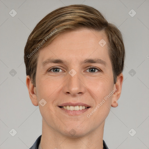 Joyful white young-adult male with short  brown hair and grey eyes