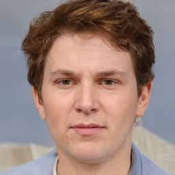 Joyful white adult male with short  brown hair and grey eyes