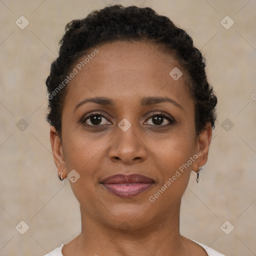 Joyful black young-adult female with short  brown hair and brown eyes