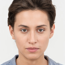 Neutral white young-adult female with short  brown hair and brown eyes