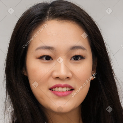 Joyful asian young-adult female with long  brown hair and brown eyes