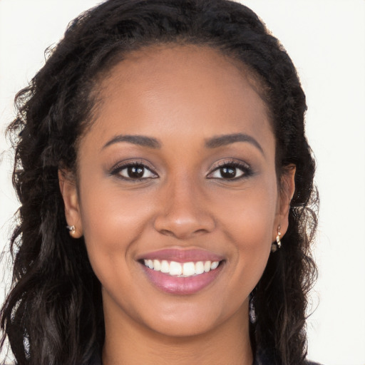 Joyful latino young-adult female with long  brown hair and brown eyes