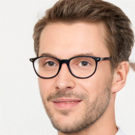 Joyful white adult male with short  brown hair and green eyes