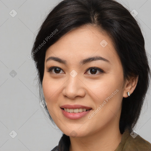 Joyful asian young-adult female with long  black hair and brown eyes