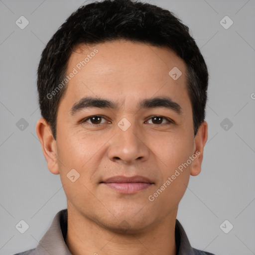 Joyful white young-adult male with short  black hair and brown eyes
