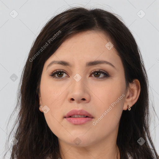 Joyful asian young-adult female with long  brown hair and brown eyes