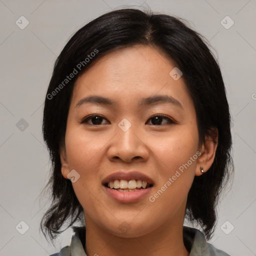 Joyful asian young-adult female with medium  black hair and brown eyes