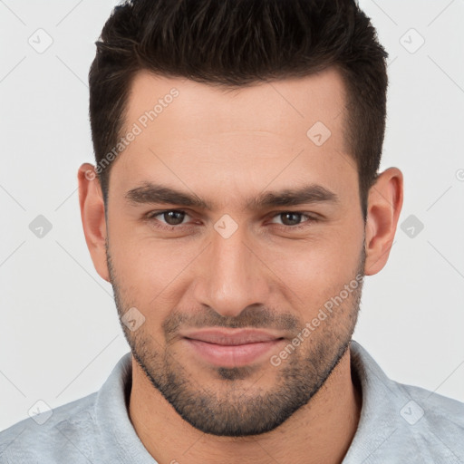 Joyful white young-adult male with short  brown hair and brown eyes