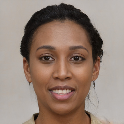 Joyful latino young-adult female with short  brown hair and brown eyes