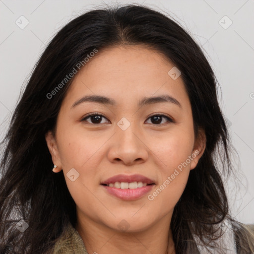 Joyful latino young-adult female with long  brown hair and brown eyes