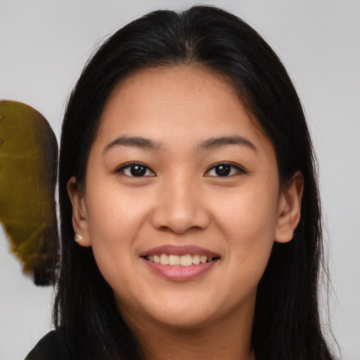 Joyful white young-adult female with long  brown hair and brown eyes
