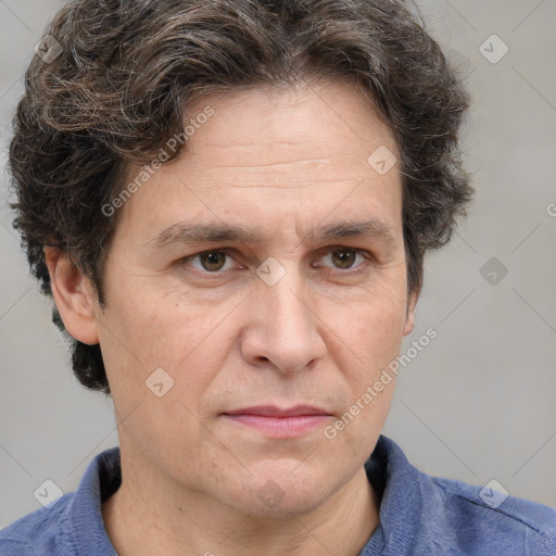 Joyful white adult male with short  brown hair and grey eyes