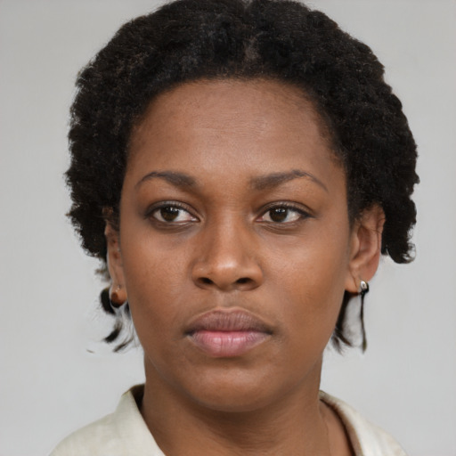 Neutral black young-adult female with short  brown hair and brown eyes