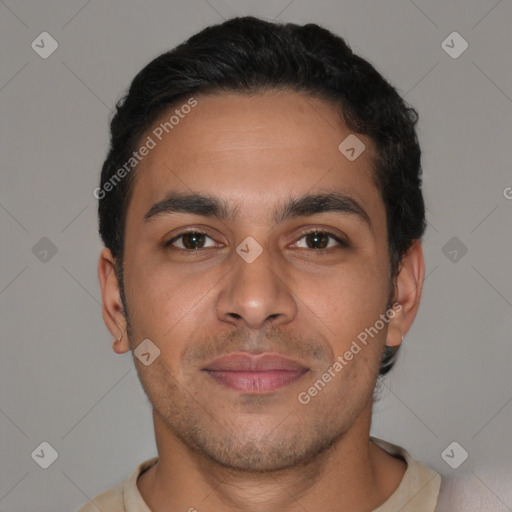 Joyful latino young-adult male with short  brown hair and brown eyes