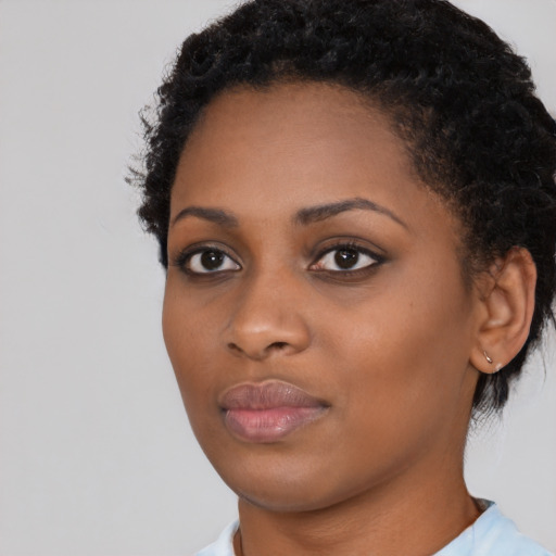 Neutral black young-adult female with short  black hair and brown eyes