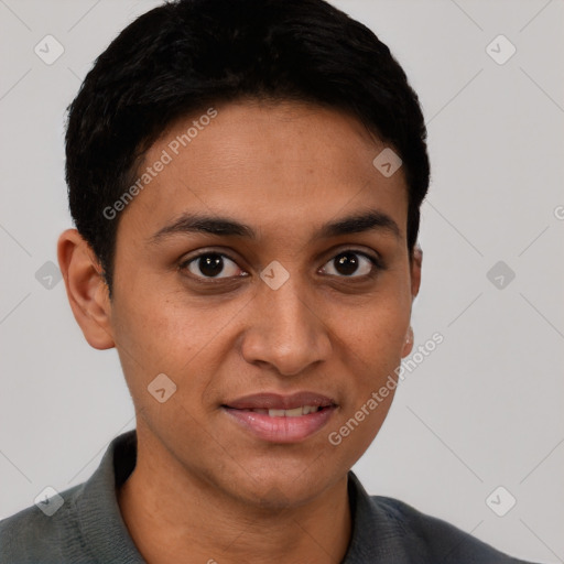 Joyful latino young-adult male with short  brown hair and brown eyes