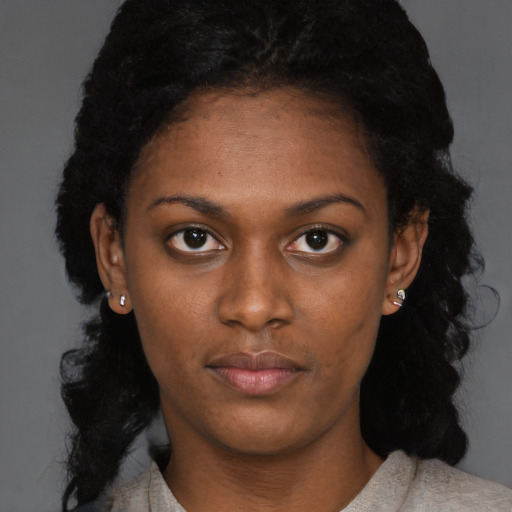 Neutral black young-adult female with long  black hair and brown eyes