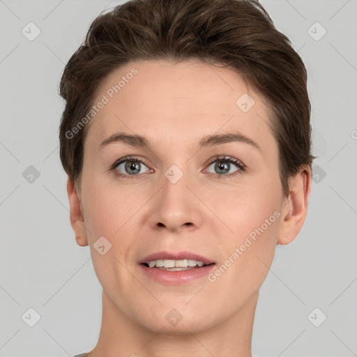 Joyful white young-adult female with short  brown hair and grey eyes