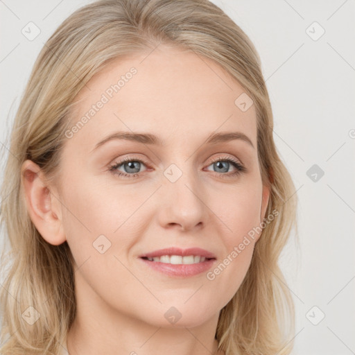 Joyful white young-adult female with long  brown hair and blue eyes