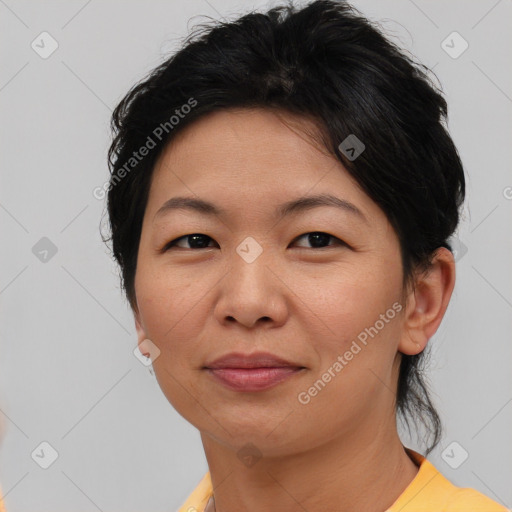 Joyful asian adult female with short  brown hair and brown eyes