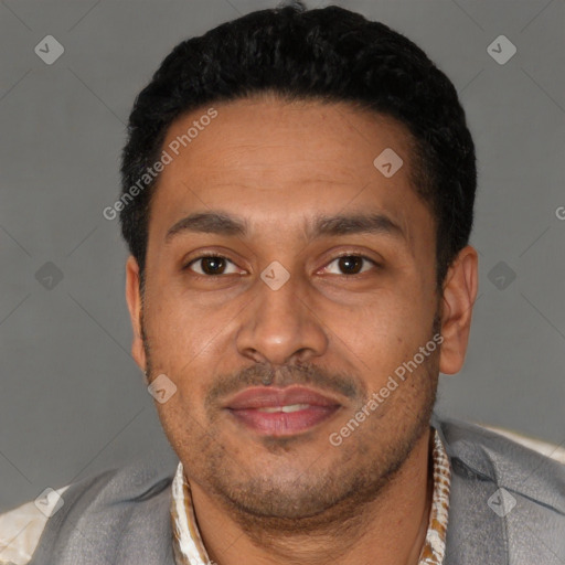 Joyful latino young-adult male with short  black hair and brown eyes