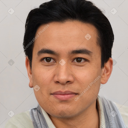 Joyful asian young-adult male with short  black hair and brown eyes