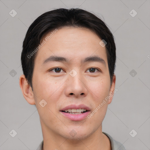 Joyful asian young-adult male with short  black hair and brown eyes