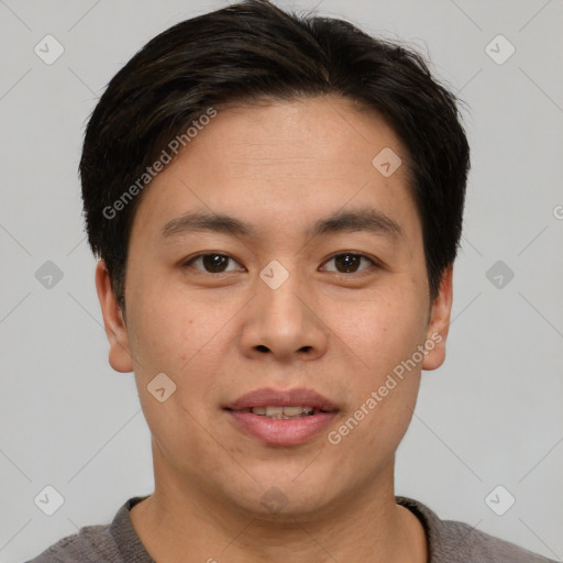 Joyful asian young-adult male with short  brown hair and brown eyes