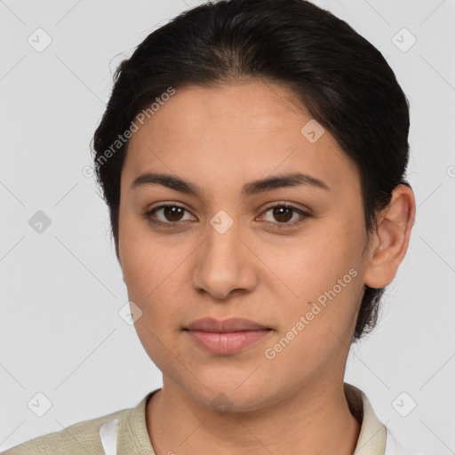 Joyful latino young-adult female with short  brown hair and brown eyes