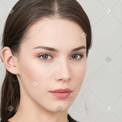 Neutral white young-adult female with long  brown hair and brown eyes