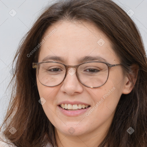 Joyful white adult female with long  brown hair and brown eyes