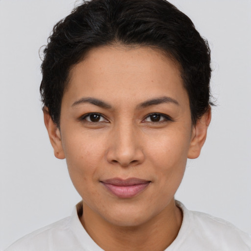 Joyful asian young-adult female with short  brown hair and brown eyes