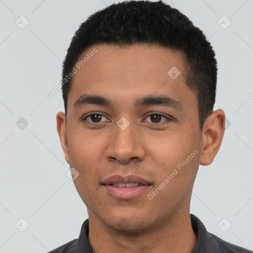 Joyful latino young-adult male with short  black hair and brown eyes