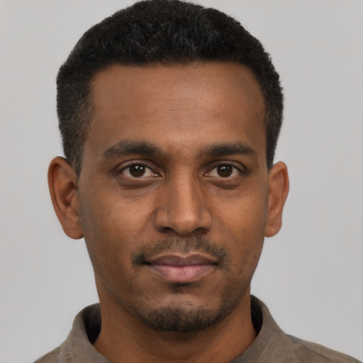 Neutral black young-adult male with short  black hair and brown eyes