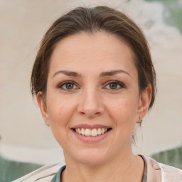 Joyful white young-adult female with medium  brown hair and brown eyes