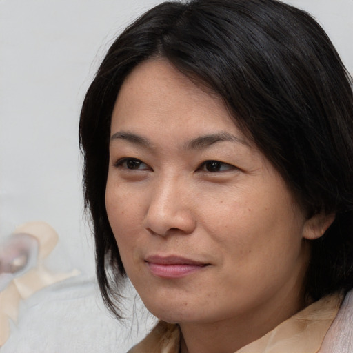 Neutral asian young-adult female with medium  brown hair and brown eyes