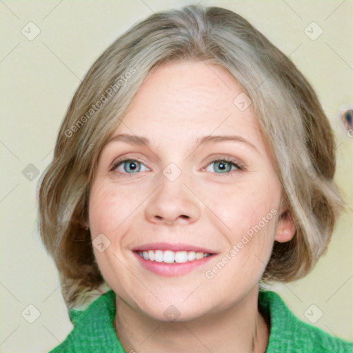 Joyful white adult female with medium  brown hair and green eyes