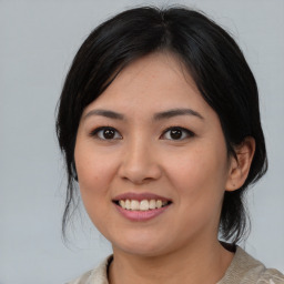 Joyful asian young-adult female with medium  black hair and brown eyes