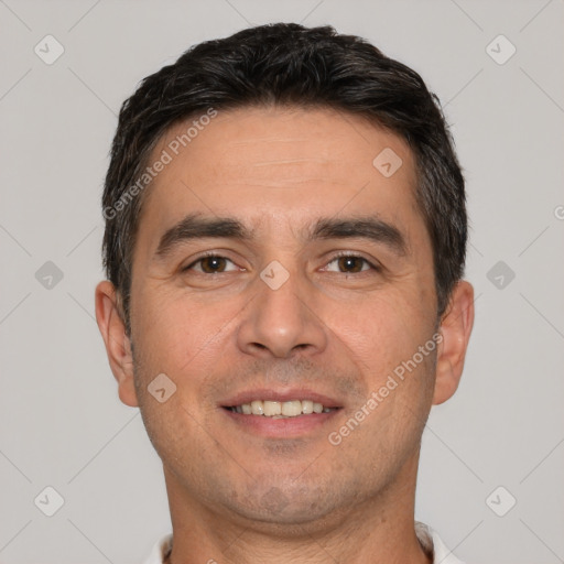 Joyful white adult male with short  brown hair and brown eyes