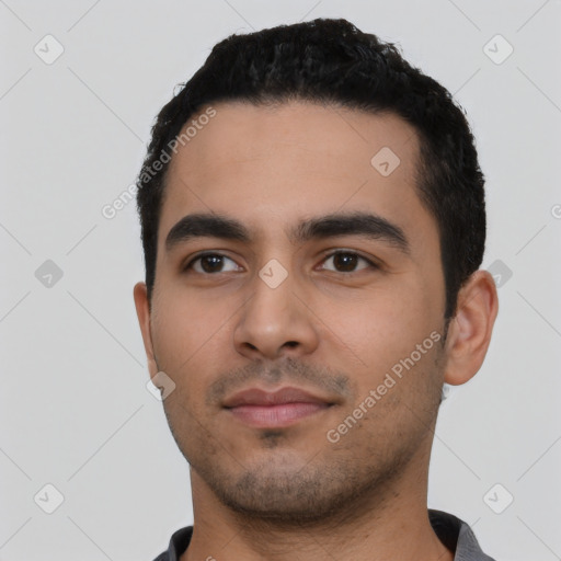 Neutral latino young-adult male with short  black hair and brown eyes