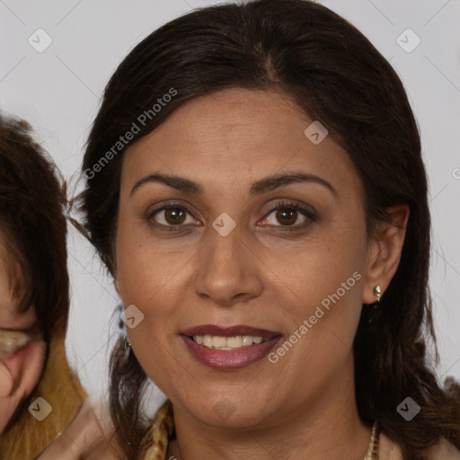 Joyful white adult female with long  brown hair and brown eyes