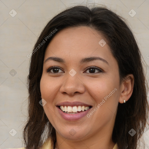 Joyful latino young-adult female with long  brown hair and brown eyes