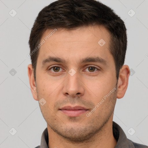 Joyful white young-adult male with short  brown hair and brown eyes