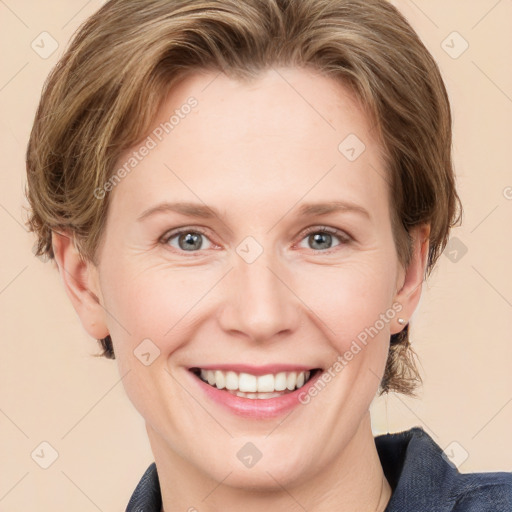 Joyful white young-adult female with medium  brown hair and blue eyes