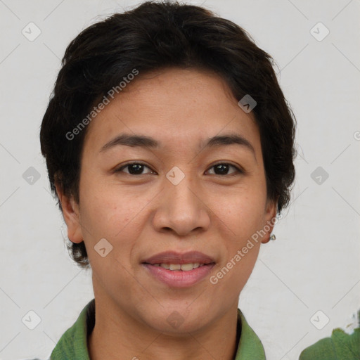 Joyful asian adult female with short  brown hair and brown eyes