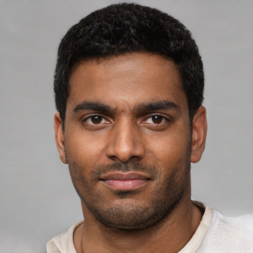 Neutral black young-adult male with short  black hair and brown eyes